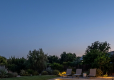 Pool concept with softer illumination, dark water reflections, and a restrained coping palette